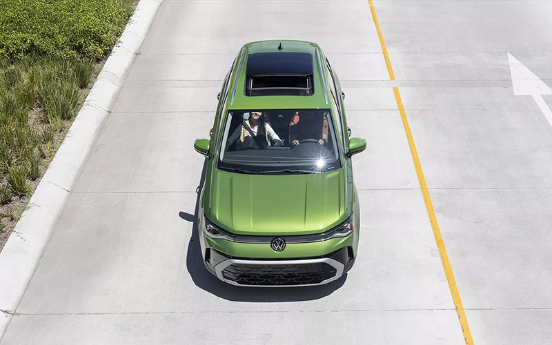 Green 2025 Volkswagen Taos on roads