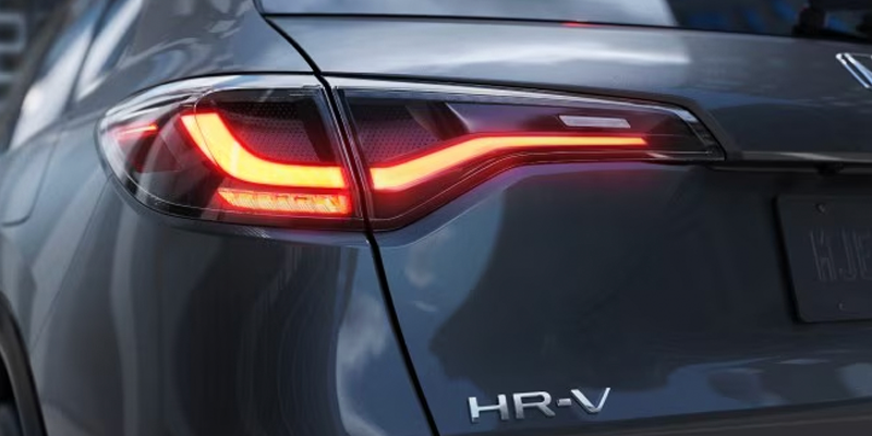Close-up view of a Honda HR-V rear taillight and badge detail.